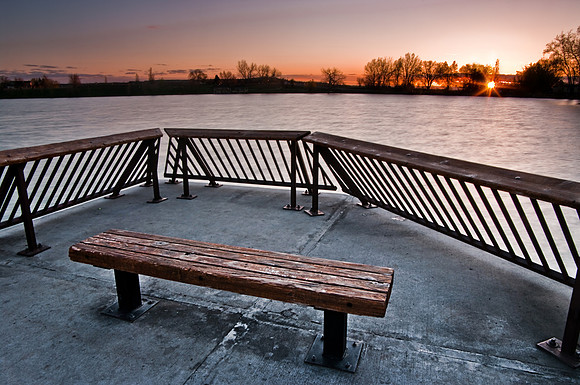 Lake Elmo fishing pier sunrise including sunstar