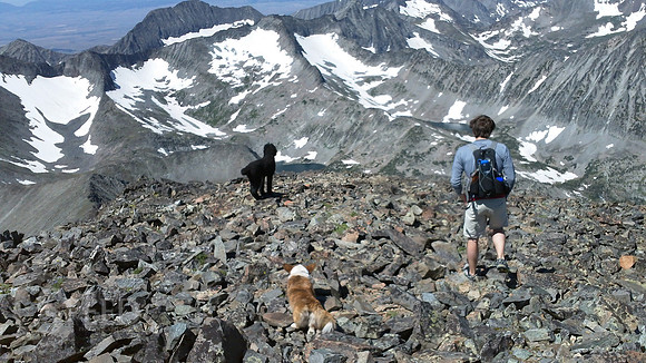 a hiker descends from Crazy Peak