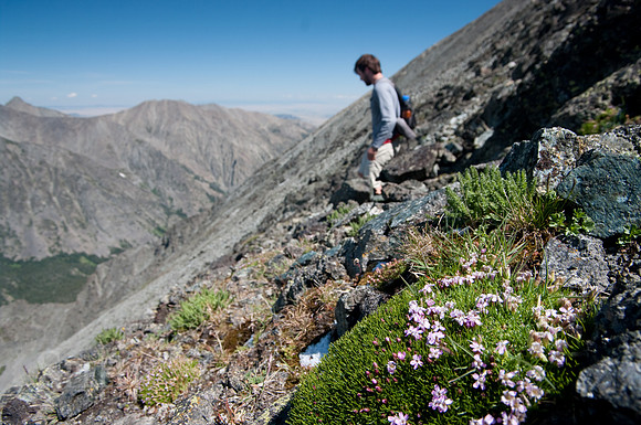 a hiker descends from Crazy Peak