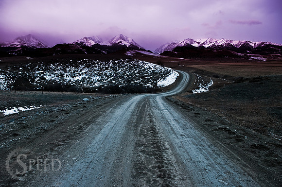 A color enhanced image of the road leading into the crazy mountains.