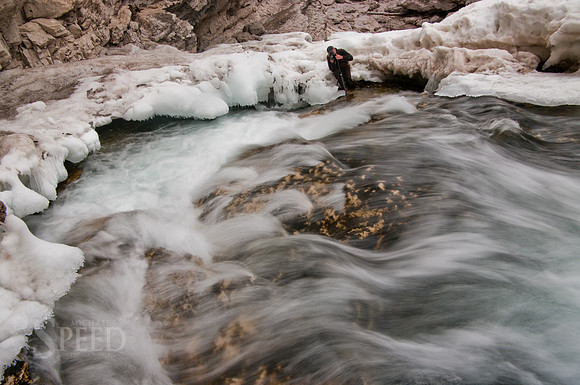 A photographer capturing images of the ice on the Boulder River