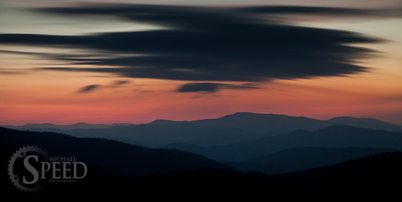 Long exposure of moving clouds over blue ridge mountains.