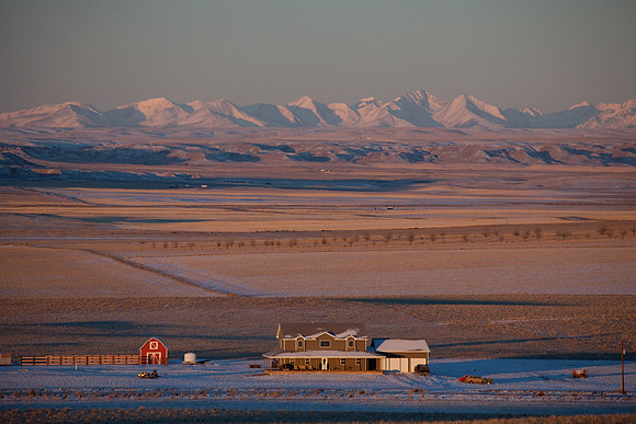A homestead and the Crazy Mountains