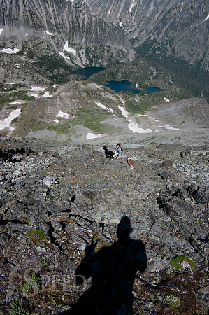 a hiker descends from Crazy Peak