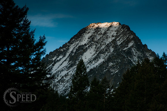 The sun just starting to hit the peaks of the crazy mountain range.