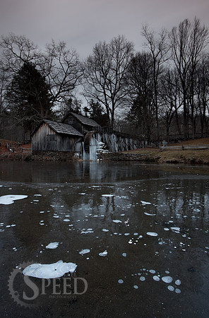 A color image of the Mabry Mill and the pond in front of it.