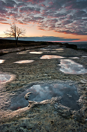 Water puddles on Billings' rimrocks at sunrise