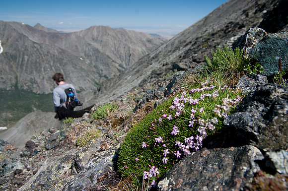 a hiker descends from Crazy Peak