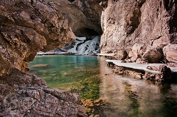 Natural Bridge Falls with foreground rock texture