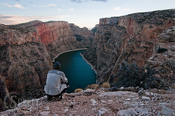 hiker looks out over devil canyon